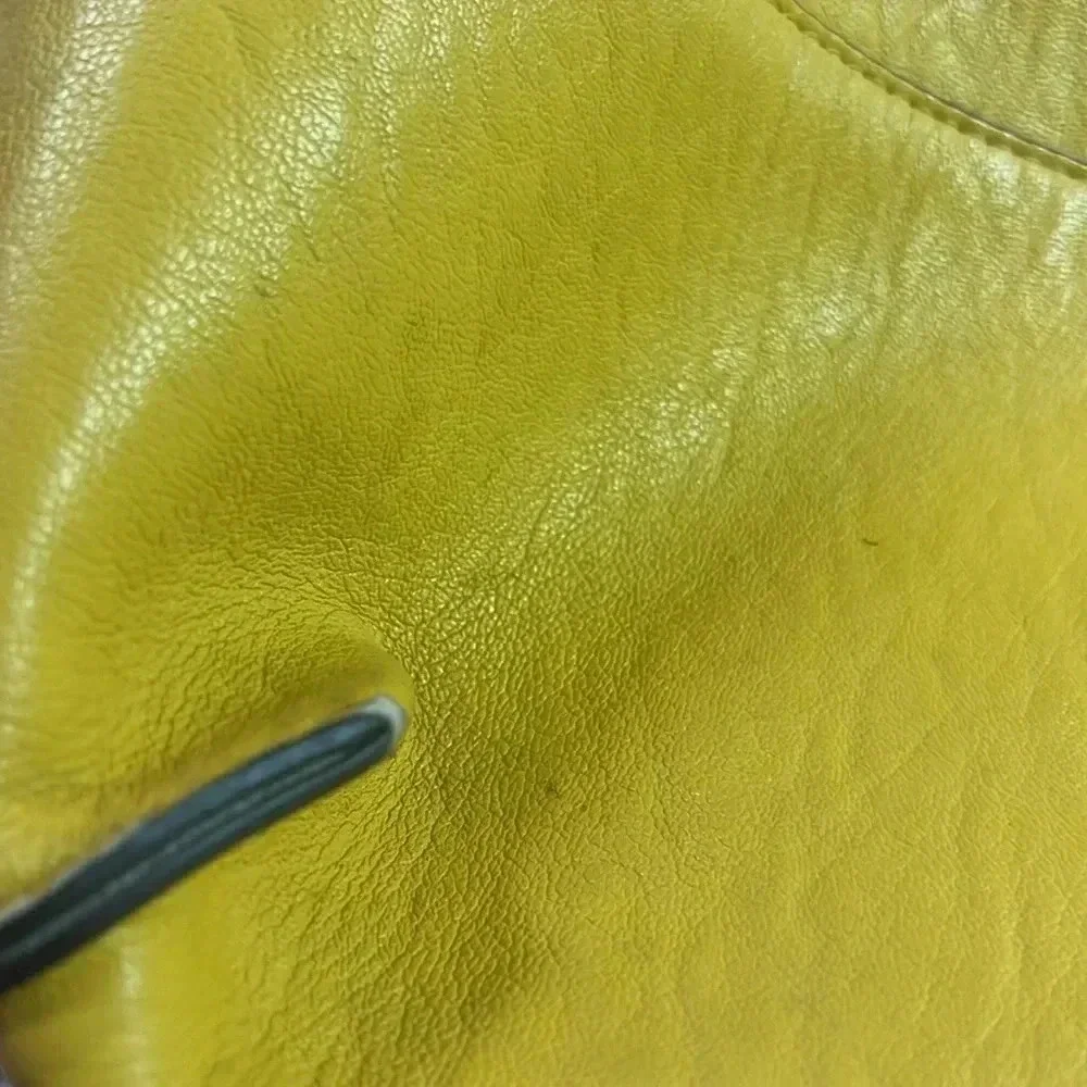 Calvin Klein few spots well loved pvc material.